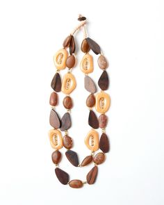 Talk about a statement necklace! Oblong shaped wood beads Clear crystal and plated gold metal beads Button closure Wrapped with full-grain leather Fair Games, Metal Beads, Wood Beads, Clear Crystal, Full Grain Leather, Talk About, Sale Items, Gold Metal, Womens Necklaces