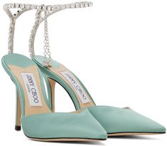 Satin heels in green. · Pointed toe · Hook-eye ankle strap · Crystal-cut charm at heel · Logo patch at leather footbed · Covered stiletto heel · Suede sole · Heel: H4 in Supplier color: Smoke green/Crystal Ivory Pumps, Jimmy Choo Pumps, Crystal Heels, Fringe Bags, Satin Heels, Satin Pumps, Green Crystal, Suede Pumps, Designer Heels