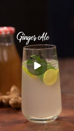 ginger ale in a glass with lemon and mint garnish