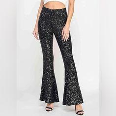 Classically-Styled Flared Leg Sequin Pants With Lined Interior Design, Ideal For Formal Occasion. Strike A Pose In These Sequined, Flared Pants Designed To Dazzle Any Special Event. The Full Lining Ensures Structure And Style. Condition: Brand New Color: Black True To Size Large: 30 Glamorous Party Leggings With Stretch, Glamorous Stretch Leggings For Party, Black Glitter Party Bottoms, Metallic High Waist Pants For Party Season, Metallic Sequin Stretch Pants, Metallic Sequined Stretch Pants, Metallic Leggings For Fall Party, Metallic Stretch Pants With Sequins, Glamorous Black Flare Bottoms