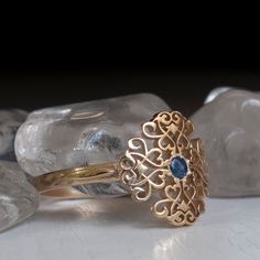 A Timelessly beautiful Victorian Style Gold ring set with a Blue Sapphire and Flourished with Antique Floral patterns. Sheer beauty and Elegance in this Charming treasure of a ring. Perfect to Wear Everyday or to special event. This Victorian Style Ring is decorated with a 12mm Wide and long Pattern. Made with Your Choice Gold Karat That can be chosen from the menu on this page. All rings Sizes available The Sapphire is 2.5mm Natural Cabochon, All other Stone requests are welcome * All items Han Medieval Ring, Victorian Style Rings, Antique Floral, Gold Ring Sets, Fantasy Jewelry, Vintage Ring, Antique Rings, Victorian Style, Stackable Rings