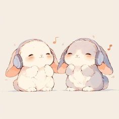 two rabbits with headphones sitting next to each other