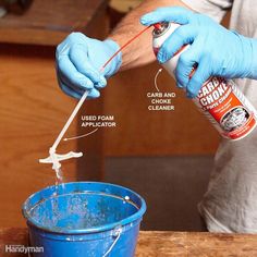 a man in blue gloves is pouring something into a bucket with the contents labeled on it