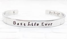 "Stamped with \"Best Life Ever\", a timeless, unique and personalized baptism gift for adults and teens who decide to be baptized along with the date of baptism and the initials at your choice. This bracelet designs to beautify your hand. 1. Please leave date in \"note to seller\" box at checkout. The date will be stamped in format \"7.16.17\" OR \"16.7.17\" due to some counties read in this format. If no specify, the date will always be stamped in format\"7.16.17\" 2. Choose INITIALS at options Hand Stamped Bracelets For Father's Day, Best Life Ever Jw, Baptism Bracelet, Adult Baptism Gifts, Adult Baptism, Best Life Ever, Jw Gifts, Baptism Gifts, Stamped Jewelry