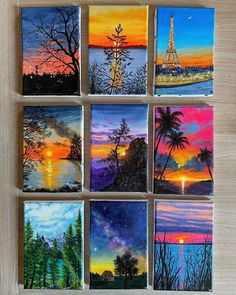 six paintings of different colors and shapes are arranged on a table with the sun setting in the background