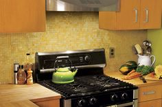 a black stove top oven sitting inside of a kitchen next to wooden cabinets and counter tops