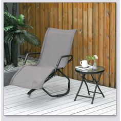 a chair and table on a wooden deck