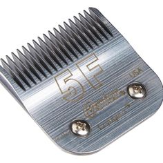 a close up of a metal comb on a white background