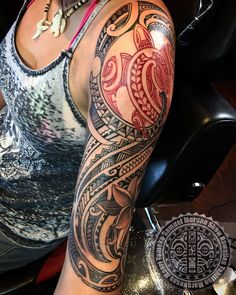 a woman with a tattoo on her arm