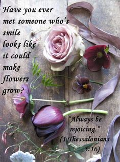 flowers and ribbons on a wooden table with a quote from the book are you ever met someone who's smile looks like it could make flowers grow?