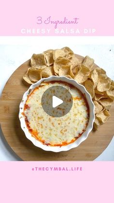 the recipe for cheesy salsa dip is displayed on a wooden platter with chips