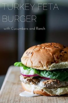 a turkey feta burger with cucumbers and ranch