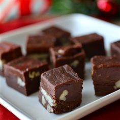 several pieces of brownie on a white plate