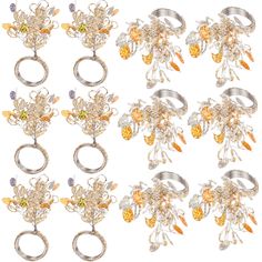 six different types of rings with flowers and leaves attached to each other on a white background