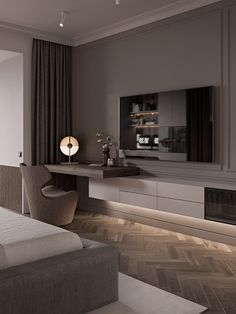 a bedroom with a bed, desk and television on the wall next to it's fireplace