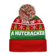 a red and green knitted beanie with the words son of a nutcracker on it