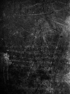 an old grungy black and white photo with lots of scratches on the surface