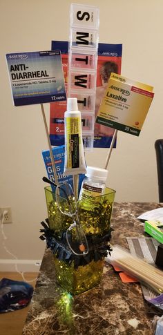 an arrangement of medical supplies sitting on a table with books and papers in the background