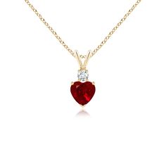 This heart-shaped ruby pendant in 14k yellow gold is a beautiful symbol of love. The bold red gem is topped with a glittering round diamond and linked to a rabbit ear bale. Ruby Rabbit, Ruby Heart Pendant, Ruby Diamond Pendant, Ruby Heart, Beautiful Symbols, Heart Pendant Gold, Ruby Pendant, Solid Gold Chains, Rose Gold Heart