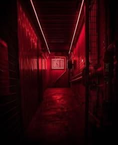 a dark hallway with red lights and a sign that says blood on the wall above it