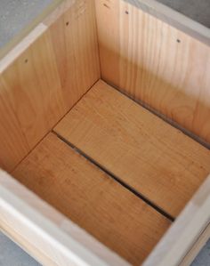 the inside of a wooden box that is being built