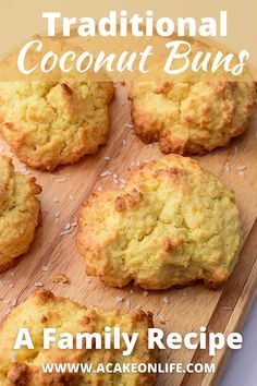 some biscuits on a wooden board with text overlay that says traditional coconut buns