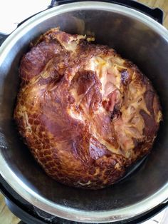 a cooked meat in a pot on the stove