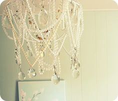 a chandelier hanging from the ceiling in a room