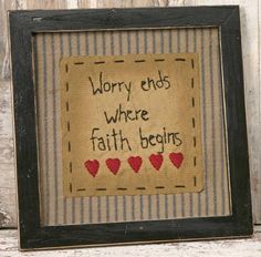 a framed cross stitch with words written on it