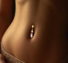 Certified Gold Belly Piercing - 8K, 9K, 10K, 14K, 18K Add a touch of luxury to your style with our premium gold belly piercings, available in 8K, 9K, 10K, 14K, and 18K gold. Each piece is crafted with precision and care, ensuring both durability and elegance.a010 Key Features: *Certified and Guaranteed: All our jewelry comes with certification and is backed by a guarantee for authenticity and quality. *Health and Safety: Due to the nature of this product being for personal use, we do not accept Belly Piercing Gold, Piercing Belly Button