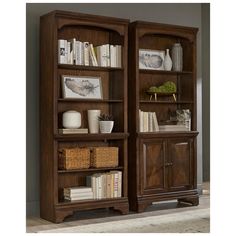 two wooden bookshelves with baskets on each shelf