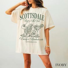 a woman wearing a white t - shirt that says scottsdale before the end of it