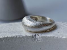 We offer worldwide express shipping in 1-5 days maximum, with DHL. You can choose this option during check out.  Stering Silver Bubble Ring - Wide Ring - Men Ring - Women Rings - Thick Ring - Modern Ring - Textured Rings - Minimalist Rings -Gift for Him A wide bubble ring, made from 925 sterling silver. Very substantial and yet incredibly comfortable due to its small shank. Super smooth and sleek design, this one is a statement piece! Can easily work for both men and women!   This ring would mak Rings Thick, Rings Minimalist, Bubble Ring, Thick Ring, Wide Ring, Perfect Cocktails, Ring Men, Textured Ring, Men Ring