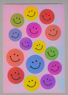 a bunch of smiley faces on a pink and blue background with colored circles in the middle