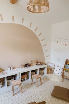 a child's playroom with toys and books