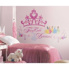 a bedroom with princess wall decals on the walls