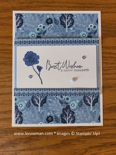 a card with a blue flower on it