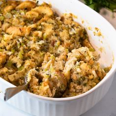 a casserole dish filled with stuffing and vegetables