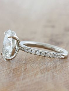 A gorgeous 1.6 mm diamond band makes this ring delicate, feminine and everything a woman wants. Her platinum setting holds a brilliant oval diamond. Interested in seeing wedding band pairings? Check out some options here. Drop-down diamond options represent our recommended grade, which maximizes size for value, while maintaining eye-perfect clarity and giving you a colorless look. For other diamond options, see our Shop Diamonds tab or speak to one of our design consultants. This design can also be made with other stone shapes. Setting only cost below: 14k Rose, White, or Yellow Gold setting $1895 18k Rose, White, or Yellow Gold setting $2195 Platinum setting $2395 Oval Diamond Ring With Platinum And Diamond Accents, Silver Platinum Oval Diamond Ring, Oval Silver Engagement Ring, Oval Platinum Diamond Ring With Diamond Accents, Oval Brilliant Cut Sterling Silver Wedding Ring, Oval Prong Set Diamond White Jewelry, Oval Diamond Engagement, Pave Diamond Band, Oval Diamond Engagement Ring