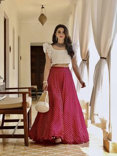 This raw silk white crop top with organza ruffles is paired with a with quirky pink banarasi skirt. Skirts For Wedding, Skirt And Crop Top Indian, Skirt And Top Indian, Crop Top Outfits Indian, Glamorous Gowns, Long Skirt And Top, Traditional Skirts, Skirt And Crop Top, Crop Top Lehenga