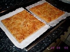 two squares of food sitting on top of a counter in front of a stovetop