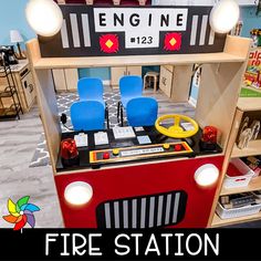 a toy firetruck with blue chairs and lights on it's front shelf