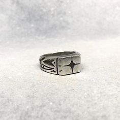 The ultimate star-gazing, night-stalking, street-walking companion ~ represent your inner kozmik verbiage in pure style with Cosmic Artifact's celebrated signet ring ~ ! Measurements ~ Top border 19mm x 4mm, band width 9mm and tapers to 5mm ~ Measurements may slightly vary across sizes Sizing ~ Please visit cosmicartifact.com/pages/ring-sizing for all sizing guides and information. Make Times ~ Each piece is made-to-order. This piece will be hand-carved from jewellers wax and cast in precious solid silver ~ Please allow 3-4 weeks before shipment. Shipping ~ All pieces come with free worldwide shipping ~ ! You can also find me online at www.cosmicartifact.com or connect via instagram.com/cosmicxartifact facebook.com/cosmicxartifact For Custom + Enquiries ~ Please be in touch via studio@cosm Adjustable Symbolic Signet Ring Stamped 925, Adjustable Silver Etched Signet Ring, Adjustable Etched Silver Signet Ring, Brutalist Sterling Silver Signet Ring Gift, Brutalist Sterling Silver Signet Ring, Silver Sterling Silver Signet Ring, Cast Rings, Star Gazing, Star Ring