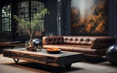 a living room with leather couches and coffee table in front of an art piece