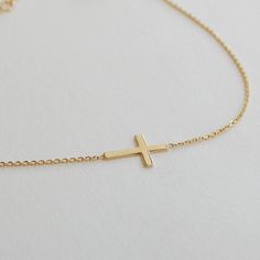 "14K Gold Tiny Cross Bracelet, Mini Sideways Cross Bracelet, Celebrity Style Cross Bracelet Gift For Christmas. Makes a perfect gift for bridesmaids, mom, wife, girlfriend, fiance or anybody else that is special to you. Comes in a cute gift box ready for gifting. This beautiful sideways cross Bracelet was made popular by Jennifer Lopez, Kelly Ripa, Selena Gomez, and many other celebrities. Make it your own and add it to any outfit to add elegance and interest. The perfect versatile piece! First Adjustable Cross Rosary Bracelet As Gift, Adjustable Chain Cross Rosary Bracelet As Gift, Elegant Cross Pendant Bracelet As A Gift, Rosary Bracelet With Cross And Adjustable Chain For Gifts, Gold Cross Bracelets For Gifts, Yellow Gold Cross Bracelet As Gift, Yellow Gold Cross Bracelets As Gift, Spiritual Cross Bracelets For Baptism, Yellow Gold Cross Bracelet For Gift