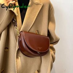 Brand Name: CyflymderShape: SaddlePlace Of Origin: ZHE JIANG ProvinceHandbags Type: Shoulder BagsTypes of bags: Shoulder & Crossbody BagsOrigin: CN(Origin)Main Material: PUClosure Type: COVERHardness: HARDExterior: Solid BagStyle: vintageLining Material: PolyesterOccasion: VersatileGender: WOMENPattern Type: SolidNumber of Handles/Straps: SingleInterior: Interior Zipper PocketDecoration: LetterItem Type: Handbags Trendy Brown Saddle Bag With Large Capacity, Brown Crossbody Saddle Bag For Errands, Trendy Brown Saddle Bag With Mobile Phone Pocket, Trendy Brown Saddle Bag With Phone Holder, Chic Brown Pouch Saddle Bag, Chic Brown Saddle Bag Pouch, Handbag Vintage, Designer Handbag, Shoulder Messenger Bag