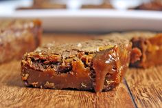 two pieces of food sitting on top of a wooden table