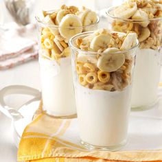 three cups filled with cereal and banana slices