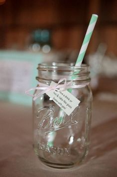 a mason jar with a straw in it and a tag on the lid that says, i love you