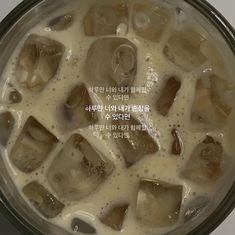 an image of ice cubes being cooked in a pot with milk and other ingredients